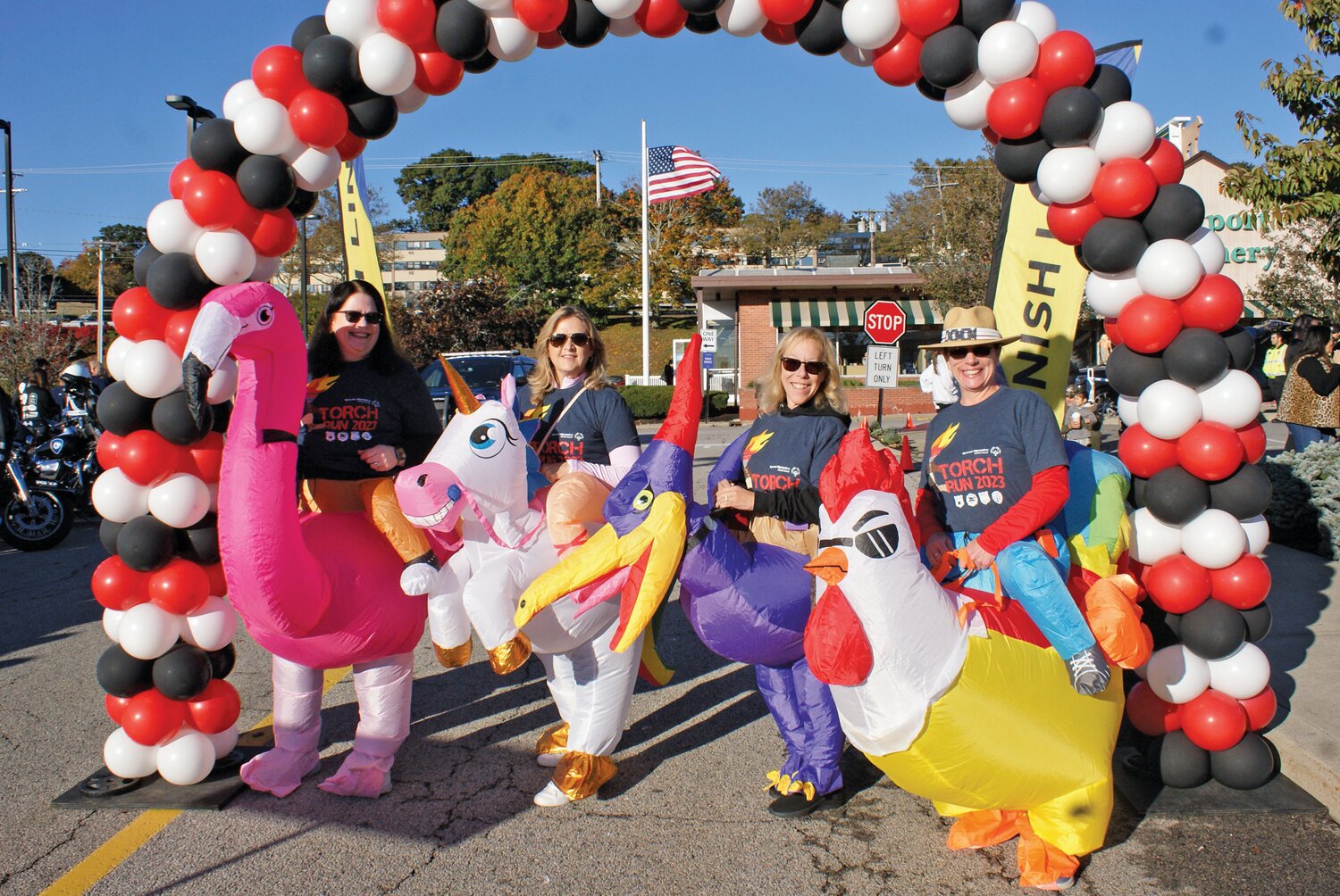 DRESSED TO MOVE: Flamingo Amy Ursillo and her friends Unicorn Karol Beattie, Pterodactyl Edye McCarthy and Rooster Rhonda Ziehl joined in the fun as members of the Walk. (Photos by Steve Popiel)